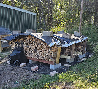 firewood stacked and covered