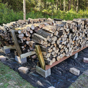 about a cord of firewood split and stacked