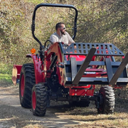 Tim driving the TnF Farms tractor