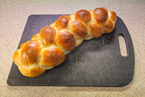 Challah bread loaf on a cutting board