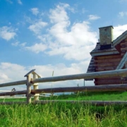 house with wooden fence in foreground